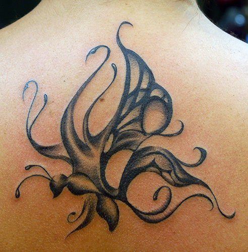 An abstract tattoo designs that uses curls and swirls to create the ...