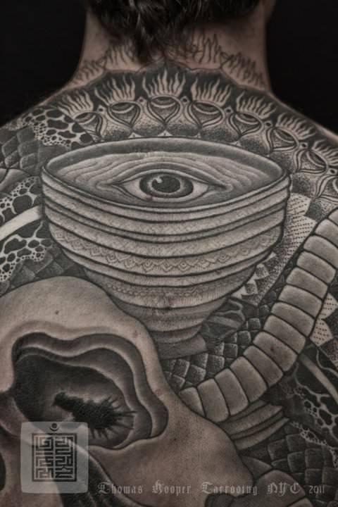 An eye is at the focal point of this Thomas Hooper geometric tattoo. The circles draw the viewer’s attention to the eye tattoo.