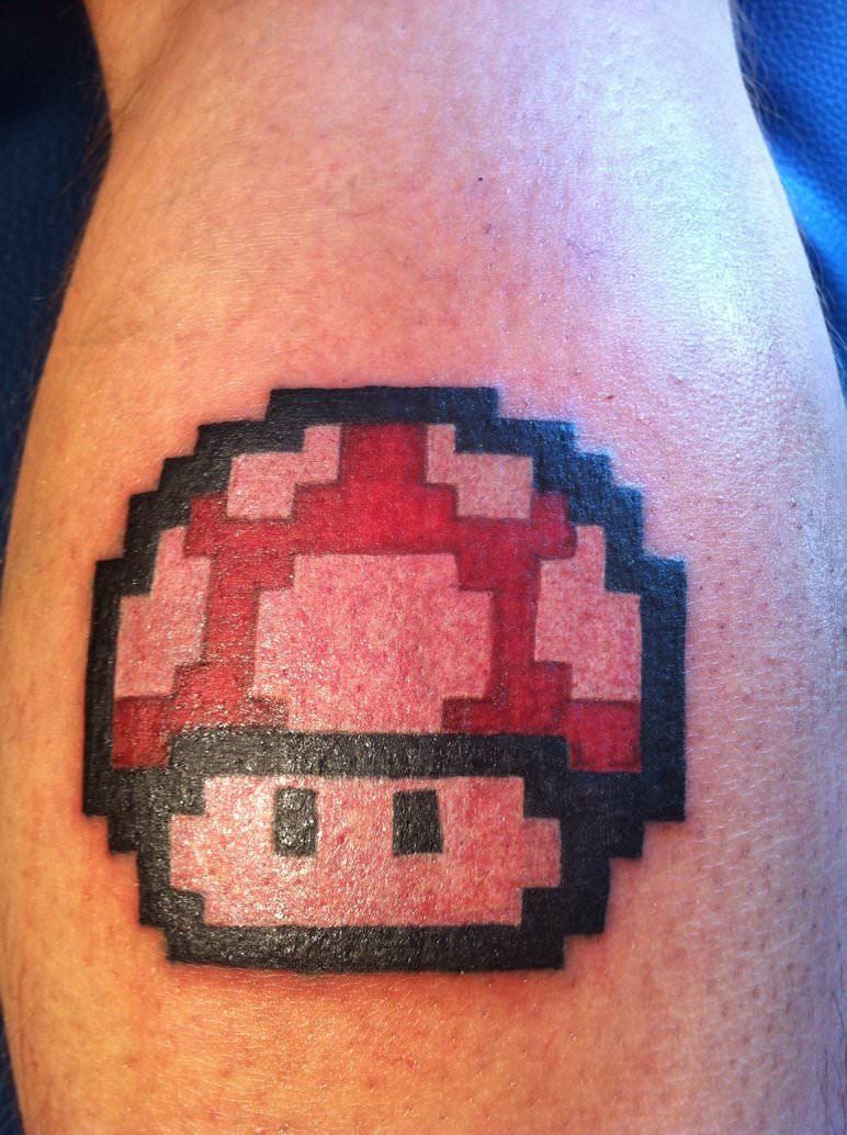 A tattoo of the 1980s magic mushroom from the Mario Nintendo games in a