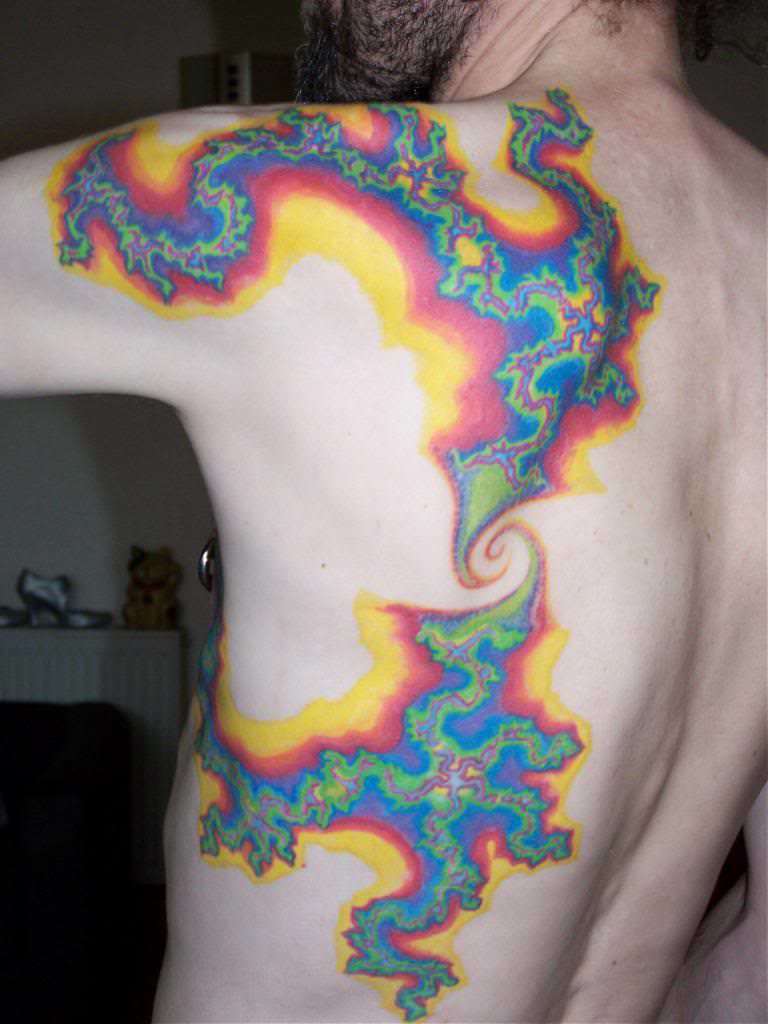 A trippy tattoo of psychedelic fractal designs in bright hallucinogenic
