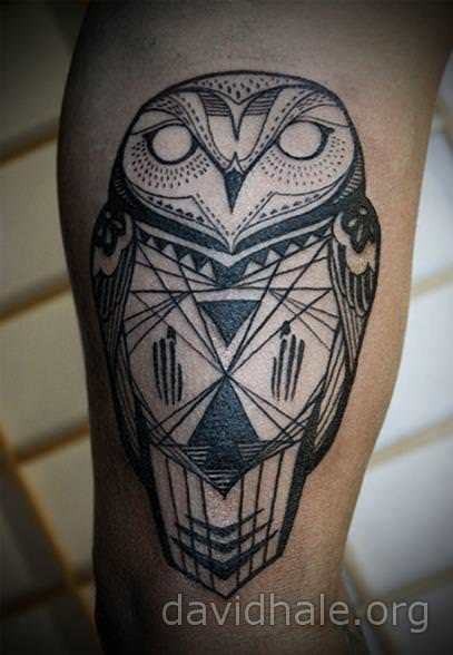 David Hale creates a modern tribal style for this totem owl tattoo