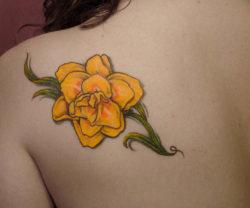 This bright yellow daffodil tattoo is a lovely way to remember a deceased loved one or to remember a friend or place