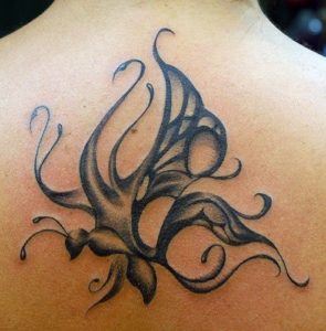An abstract tattoo designs that uses curls and swirls to create the shape of the butterfly