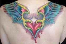 A color tattoo of a flying, bleeding heart. The wings look a bit like eagles landing, and the sun resembles a crown
