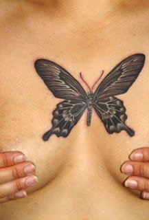 A butterfly tattoo designs between the breasts is a symbol of a life change that the woman holds close to her heart