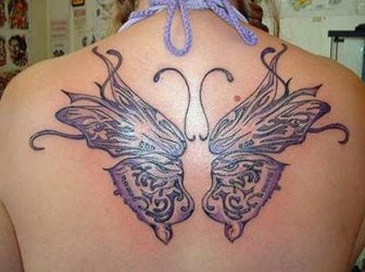 A feminine butterfly tattoo designs with girly colors and curls