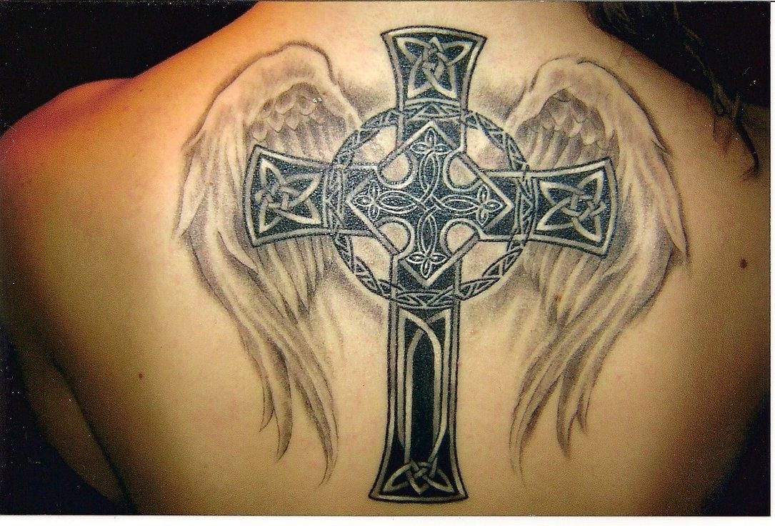 A Celtic cross tattoo with angel wings celebrates both ...
 Popular European Tattoos