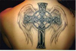 A Celtic cross tattoo design with Christian angel wings is both tribal and religious