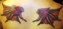A tattoo on the back and shoulders of western dragon wings that resemble bat wings