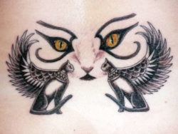 An Egyptian hieroglyph tattoo of cats with wings and cats eyes, a symbol of the goddess Bast