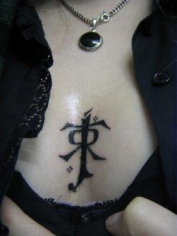 A tattoo of JRR Tolkiens signature symbol which he used to sign his books and pictures