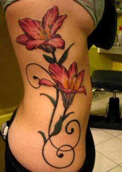 An elegant lily flower tattoo design inked from this girls ribs to her hips