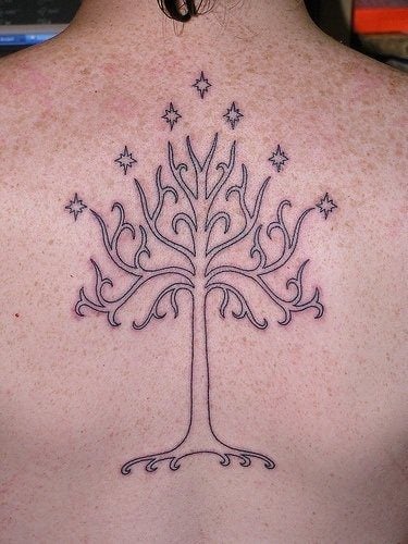 A Lord of the Rings tattoo design of the white tree of Gondor surrounded by stars