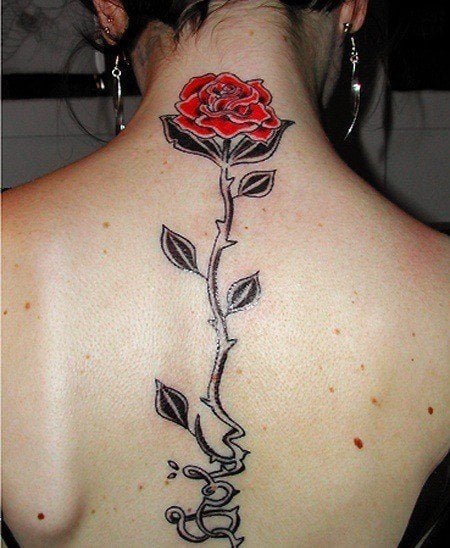 A black and red rose tattoo design that trails down the spine in a symbol of love, passion and romance