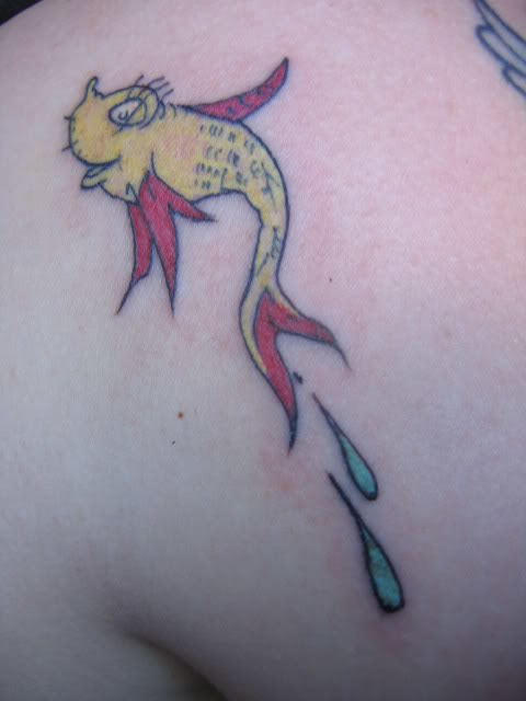 A Dr Seuss fish tattoo that uses Dr Seuss's original illustration and colors as the tattoo design.