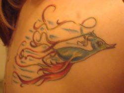 A Dr Seuss tribute tattoo that combines two Seuss characters; the fish who likes flowers from McElligott's Pool and a Seuss bird