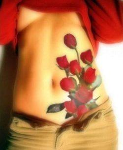 A boquet of roses adorns this girl's hip and abdomen in a colorful symbol of love, passion and fertility
