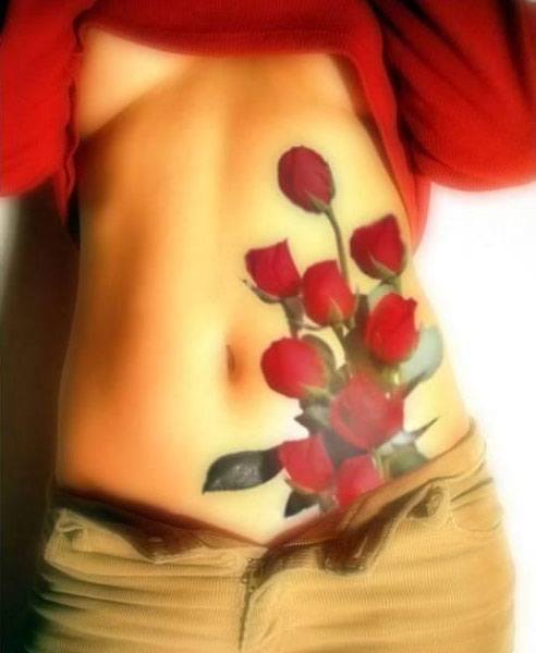 A bouquet of roses adorns this girl's hip and abdomen in a colorful symbol of love, passion and fertility