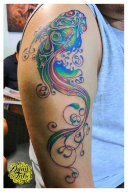A colorful abstract koi tattoo design that highlights the symbolic similarities between koi fish and butterflies