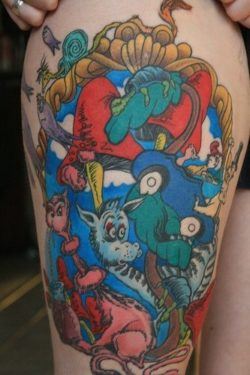 A colorful tattoo of various Dr Seuss characters, taken from the Dr Seuss childrens books.