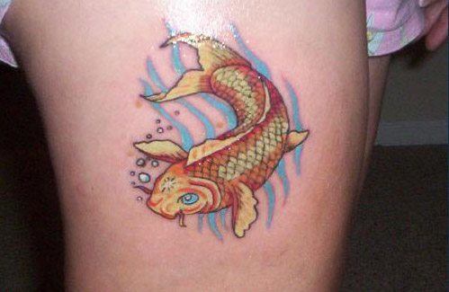 A simple and elegant koi fish tattoo that features a golden carp, a symbol of success, wealth and strength.