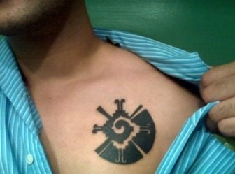 A tattoo of Hunab Ku, the Mayan symbol for unity, balance, wholeness and the universe.