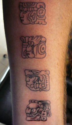 A tattoo of Mayan symbols representing gods and deities