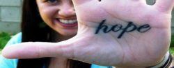 A tattoo of the word hope on this woman's palm - a lovely reminder to keep your hopes up