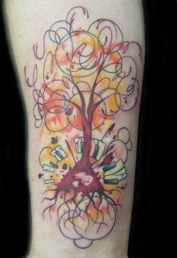 An abstract tree tattoo design with color ink, allowing the tattoo artist more freedom in the design.