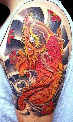 This tattoo design shows a koi transforming into a dragon after leaping up the waterfall through Dragon's Gate.