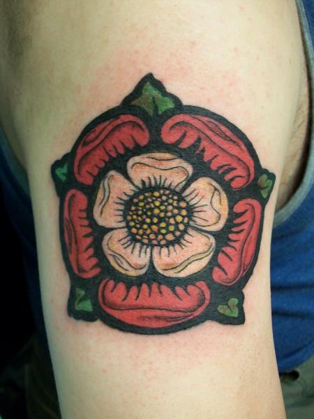 This tattoo of the Tudor rose shows the two colors of roses surrounded by green leaves in a mandala stylde design