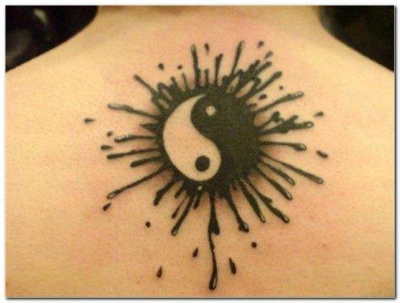 This cute yin yang tattoo sports paint splatters which adds a fun, organic element to the design