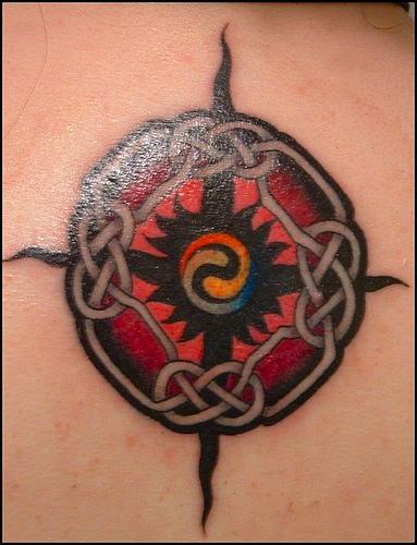 Tribal mandala tattoos like this one represent balance, because all parts of the tattoo design mirror another part