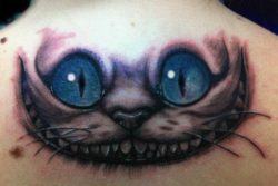 A back tattoo of the Cheshire Cat character from the 2010 movie of Alice in Wonderland
