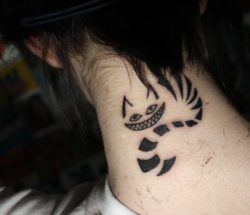 A neck tattoo of the Cheshire Cat from Alice in Wonderland