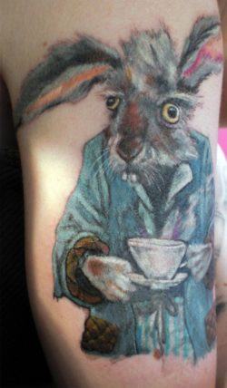 A funny tattoo design of the March Hare with a cuppa tea from Alice in Wonderland
