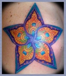 A spiritual, new age tattoo design of a star flower