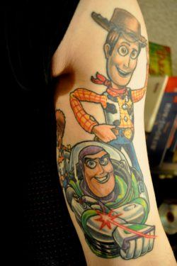 A fan art tattoo of Woody and Buzz Lightyear from the popular Pixar film Toy Story