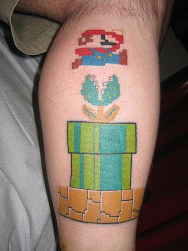 A tattoo of Mario jumping over a plant monster from the original 80s Nintendo video games