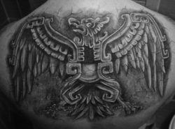 A tribal Aztec tattoo design that shows a carving of an eagle totem animal.