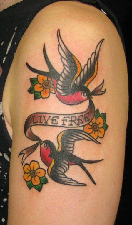 A Sailor Jerry tattoo design of two sparrows carrying a banner that reads Live Free