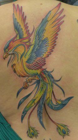 A colorful rainbow phoenix tattoo. The combination of colors symbolizes balance