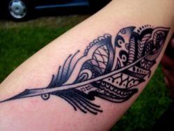 A paisley feather tattoo design that symbolizes spirituality