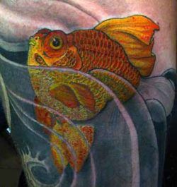 A tattoo of a golden ryukin goldfish in stylized water patterns