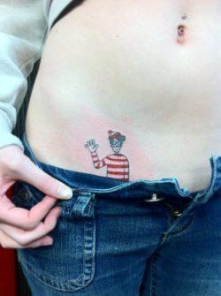 Finally, an answer to the question Wheres Waldo. Hes in this tattoo, peeking out of this girls pants