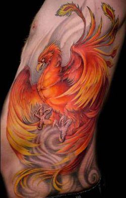 This red and orange phoenix tattoo is displayed on a background of gray swirls that symbolize air and wind
