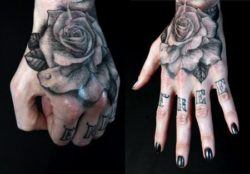 A black ink rose tattoo on the hand by Shawn Barber