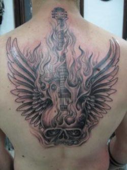 A flaming skull guitar tattoo with wings is a great design for people who enjoy rock guitar music