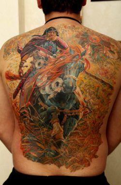 A highly detailed, quality tattoo by Dmitriy Samohin of a fantasy warrior and his powerful war horse