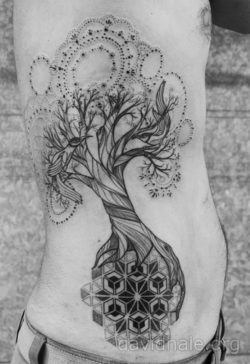 A tree of life tattoo by David Hale in which the tree grows on a mandala and has mandala leaves